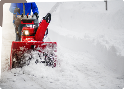 A person is using a snow blower to clear the snow.